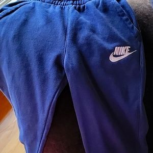 3 pairs of Nike sweat pants. 2 size medium and 1 large.